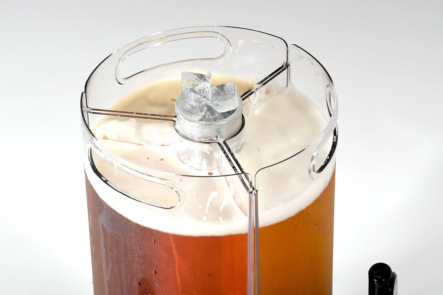 close up of ice in the core chamber and three jugs filled with beer